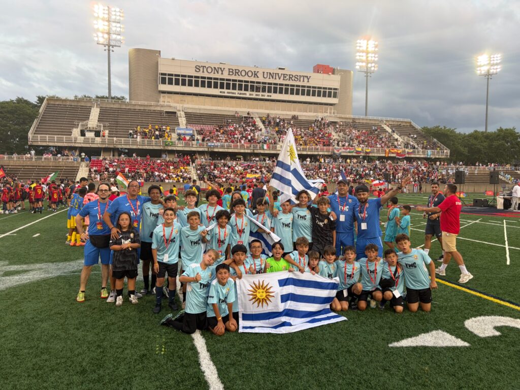 Uruguay youth teams at the Youth World Challenge 2026 in New York, holding the Uruguayan flag