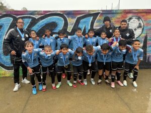 Uruguayan Soccer Academy team with coaches and medals at the SUSA Columbus Cup 2026.