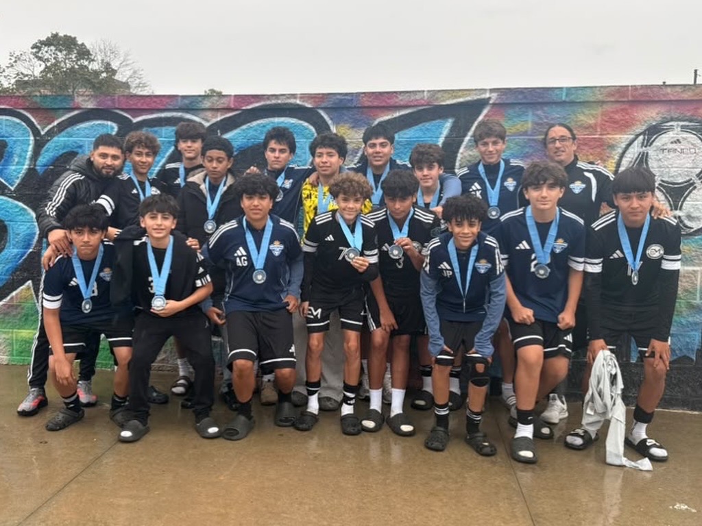 Uruguayan Soccer Academy players and coaches with their Columbus Cup medals.